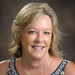 Beth Geis smiling.