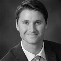 Busey associate Raymond Theron smiling