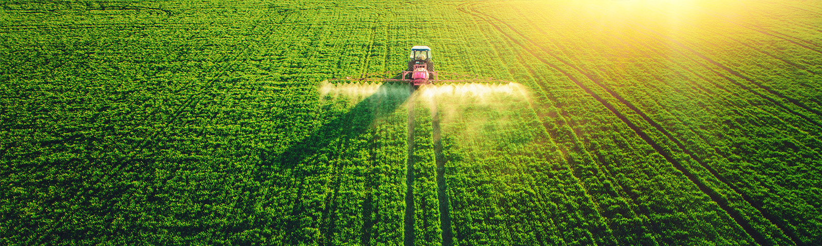 Tractor applying chemicals to field