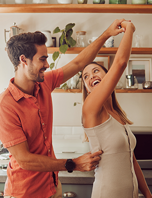 Couple celebrating purchase of home.