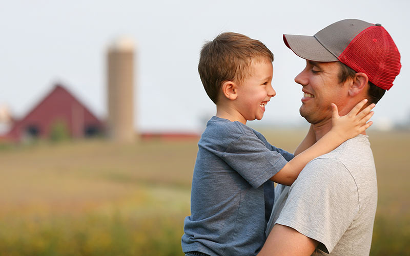 Father and son on farm