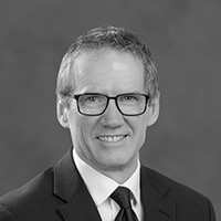 Busey associate Mike Bartochowsk smiling