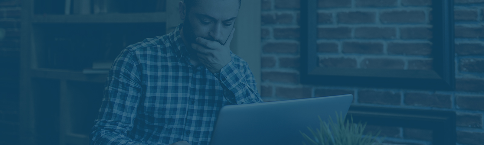 Man staring down at his computer