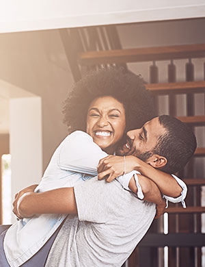 Young couple embrace.