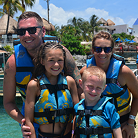 Busey Associate Dennis Warner and family smiling