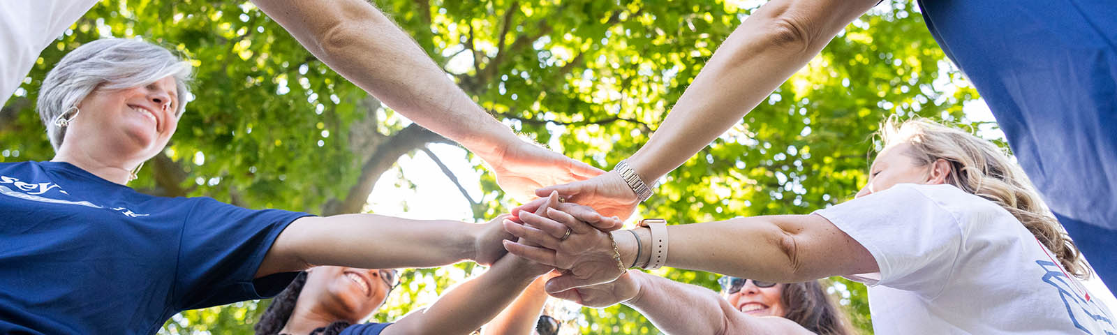 Hands placed together into a center