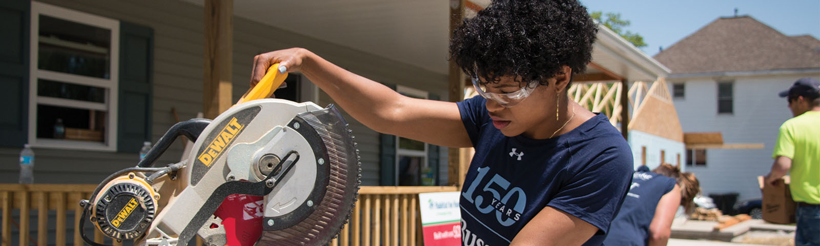 A Busey associate using a circular saw