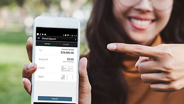 Woman pointing to mobile app screen