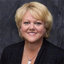 Busey associate Peggy Vallandingham smiling