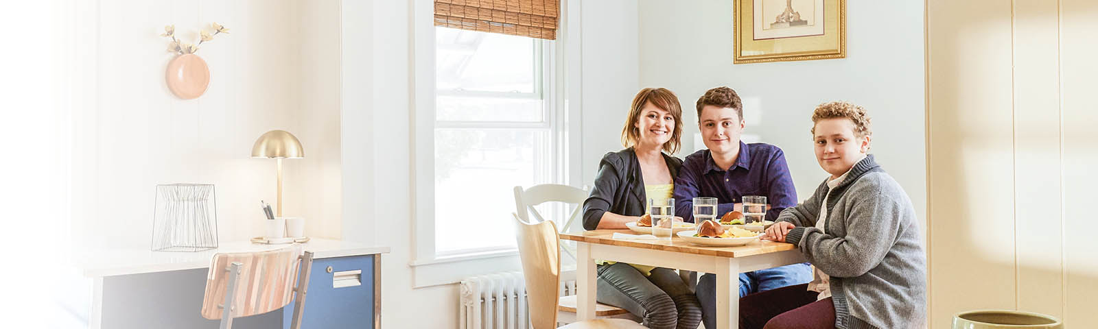 Three people sitting at table