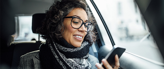 Woman using phone in car
