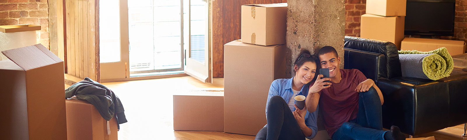 Couple unpacking boxes