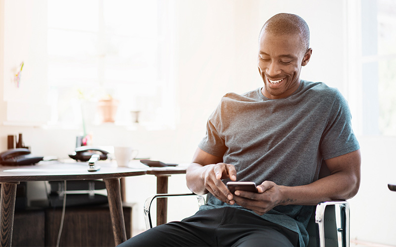 Man smiling at phone