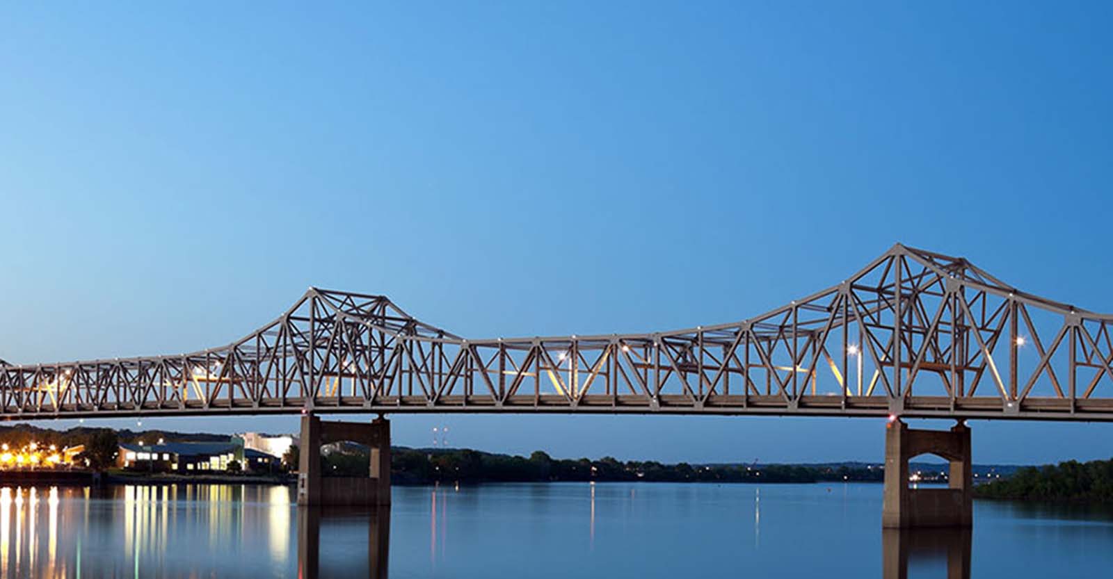 Blue sky with the Peoria Bridge spanning over a river